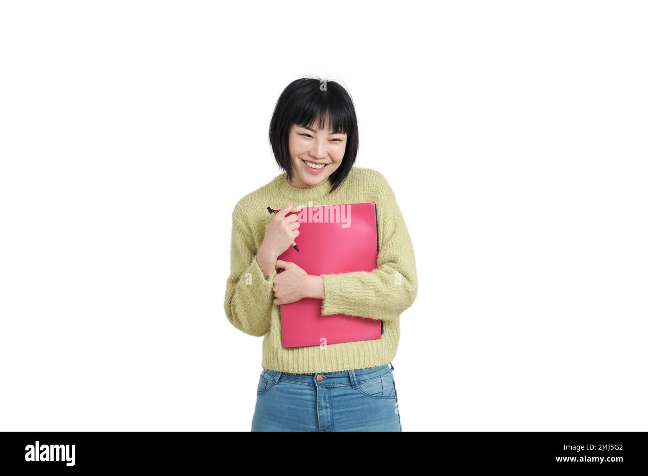 Junge asiatische Studentin mit kokettlichem Lächeln, isoliert. Stockfoto