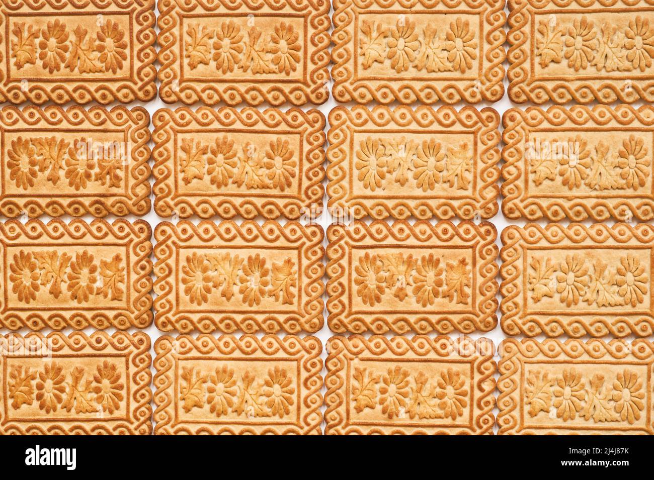 Süße Plätzchen-Textur mit schönem Muster. Hintergrund der Speisen. Stockfoto