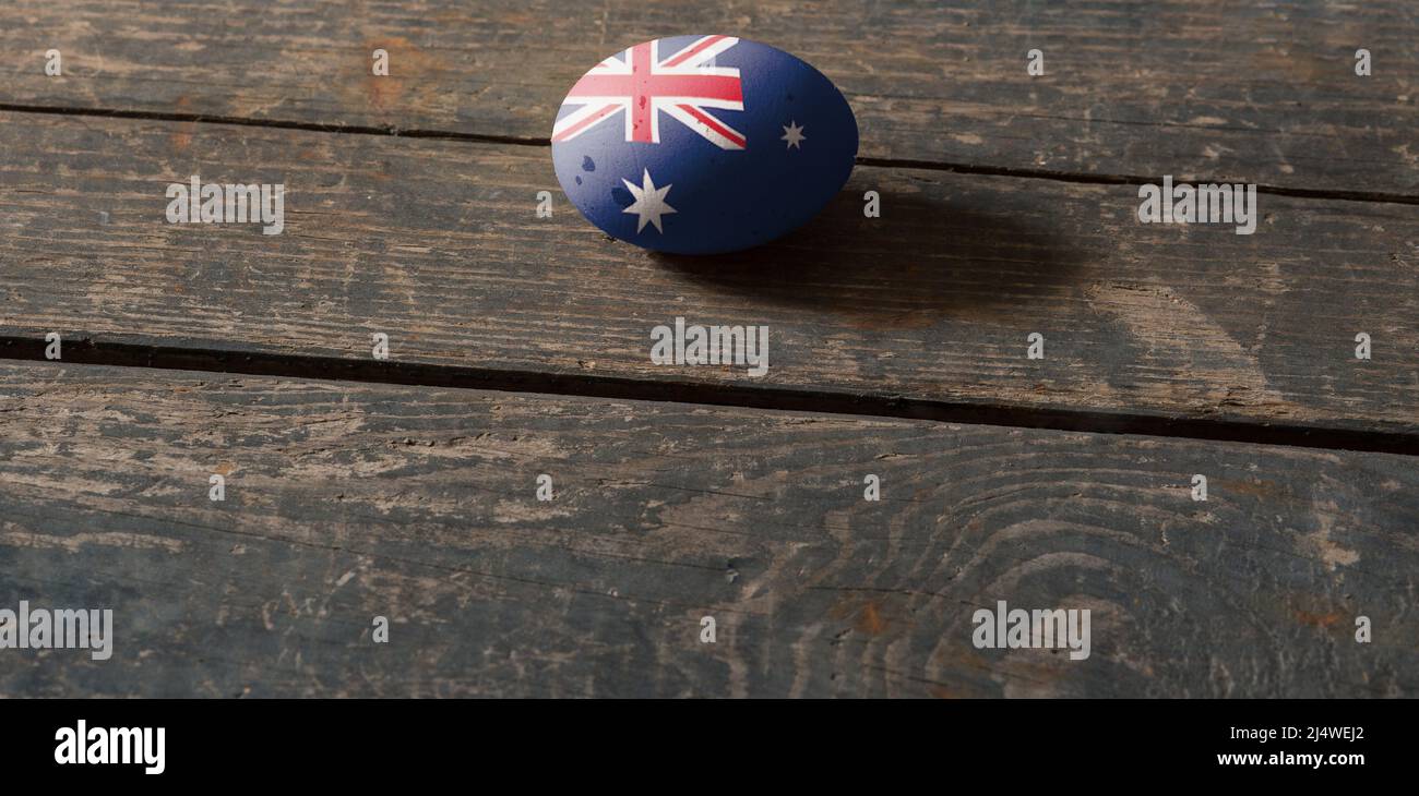 Australische Flagge auf einem bemalten Ei auf einem Holzbrett. Ostern in der Ukraine. Bemalte Eier. Osterferien Stockfoto