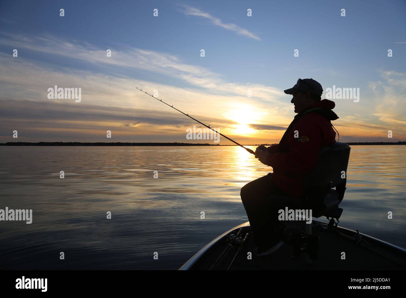 Angeln bei Sonnenuntergang Stockfoto