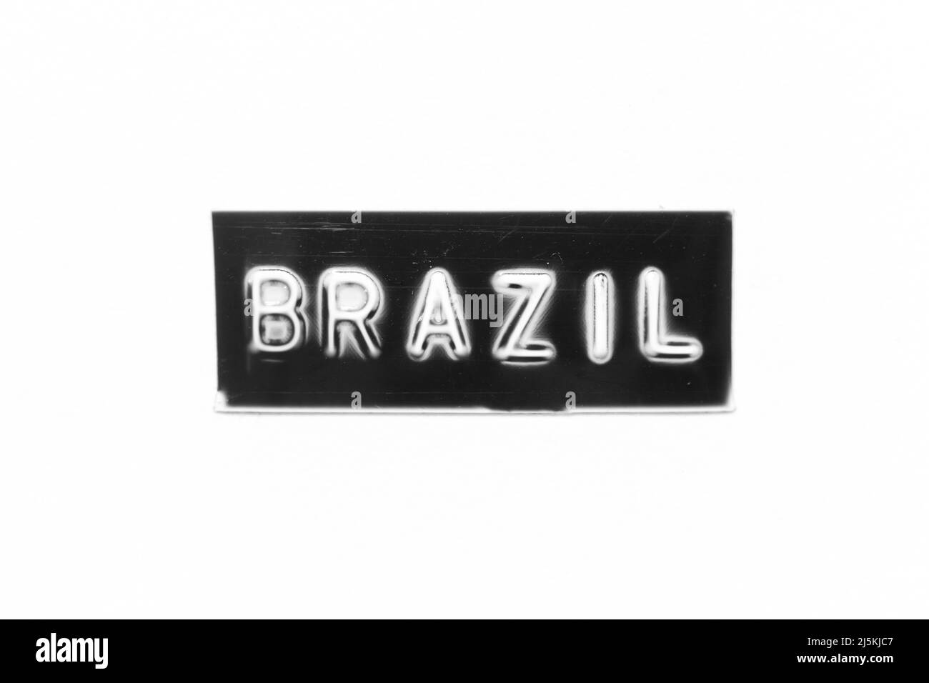 Schwarze Farbe Banner, die geprägte Buchstaben mit Wort brasilien auf weißem Papier Hintergrund haben Stockfoto
