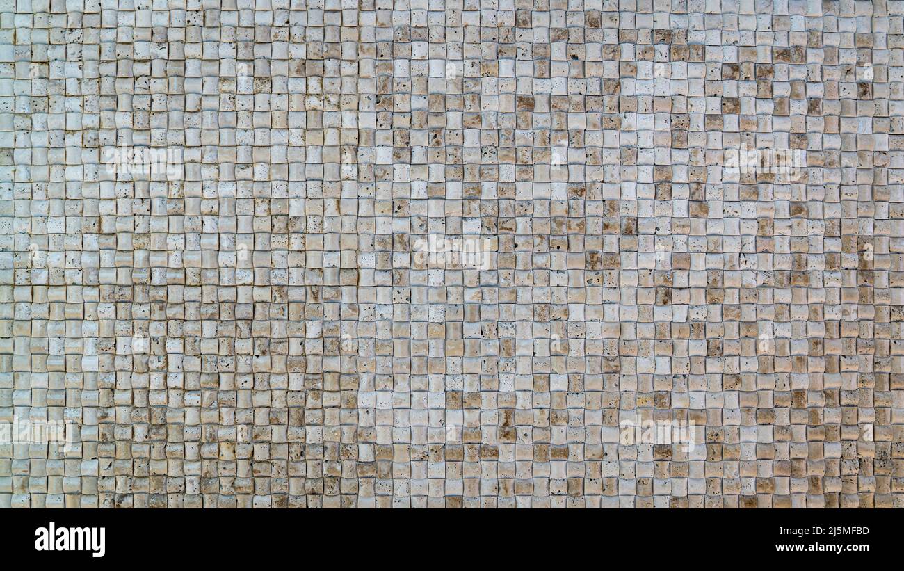 Kleine quadratische Struktur aus Granit oder Marmor für Innenwände und Dekoration. Steinstruktur. Stockfoto