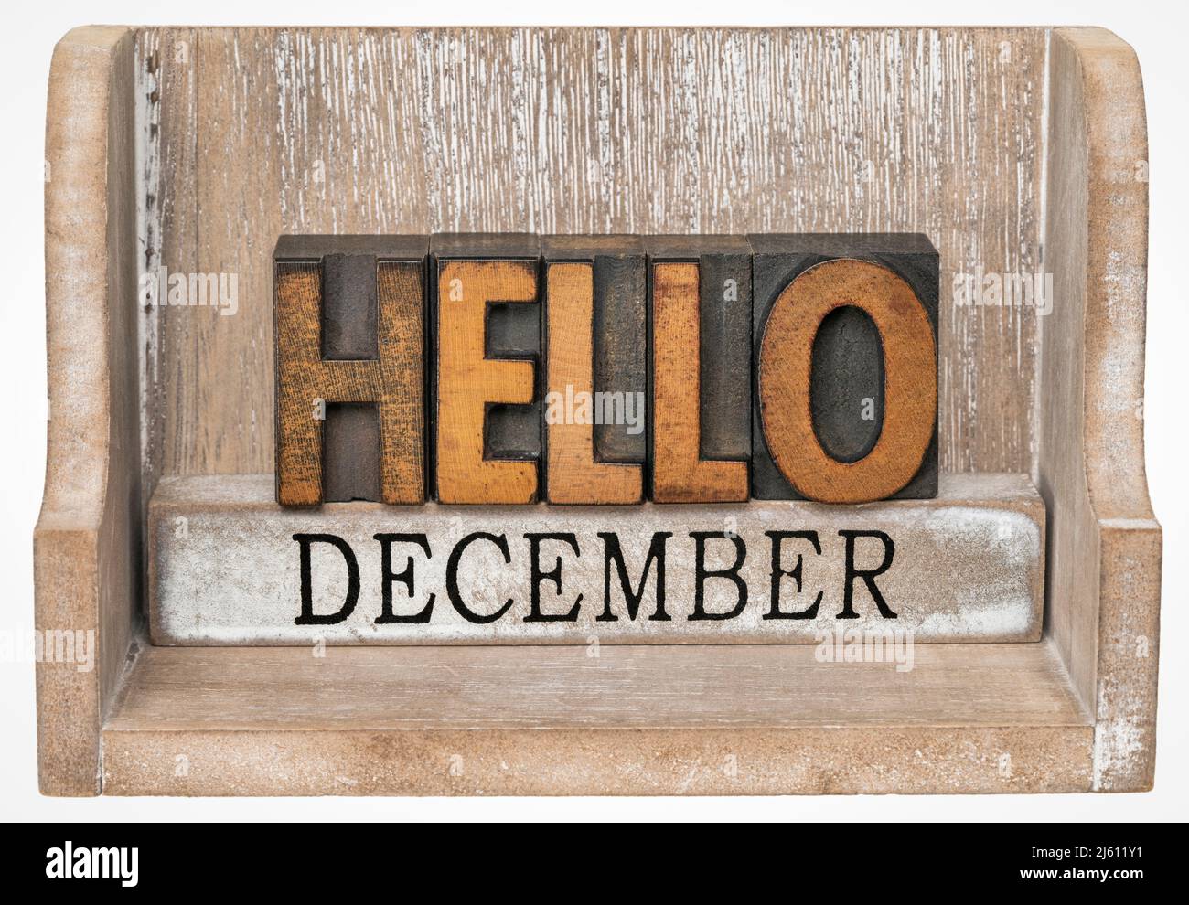 Hallo Dezember im Vintage-Buchdruck Holzart innen Grunge Holzkiste, Kalenderkonzept Stockfoto