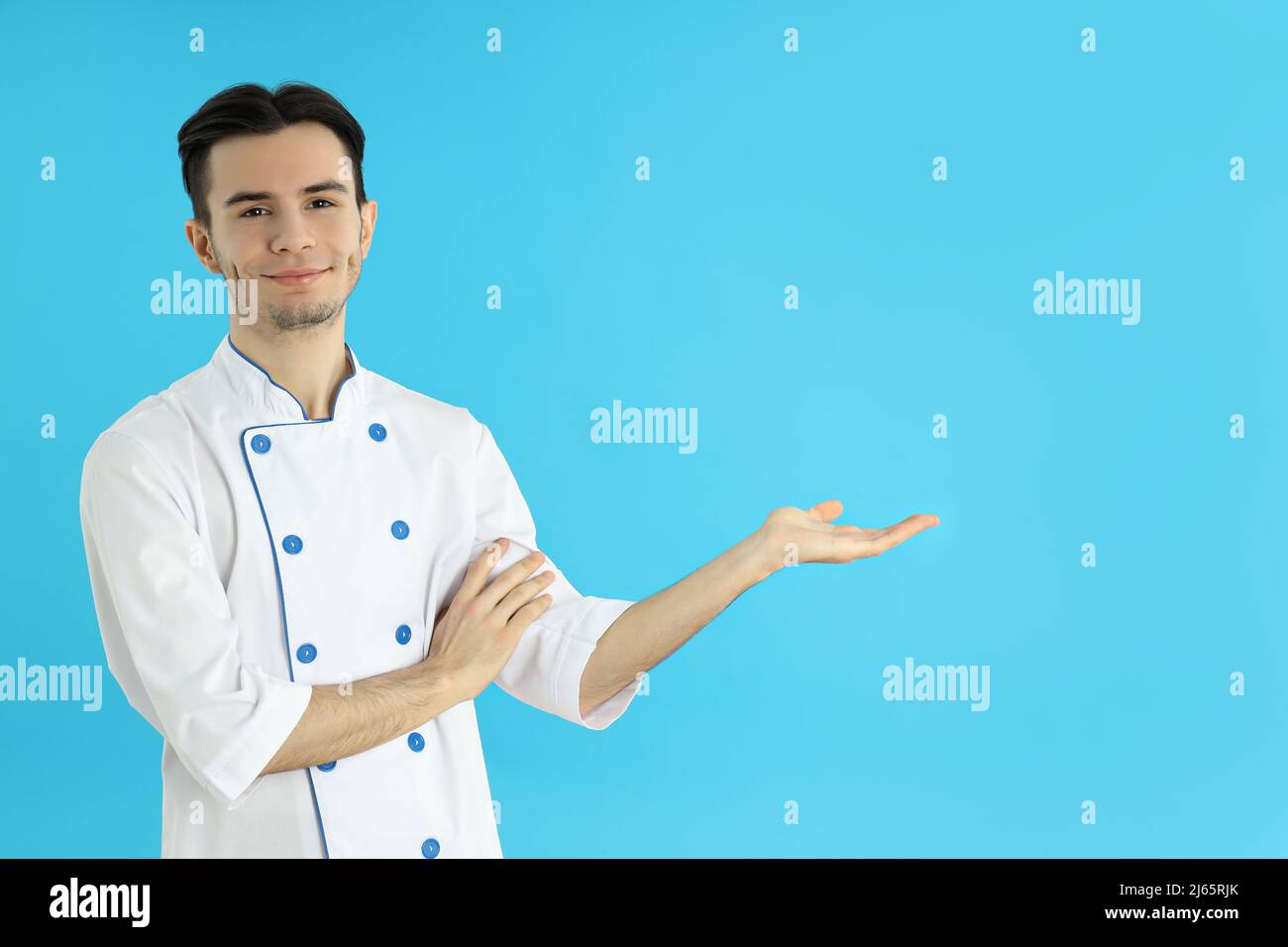 Berufskonzept, junger attraktiver männlicher Koch Stockfoto