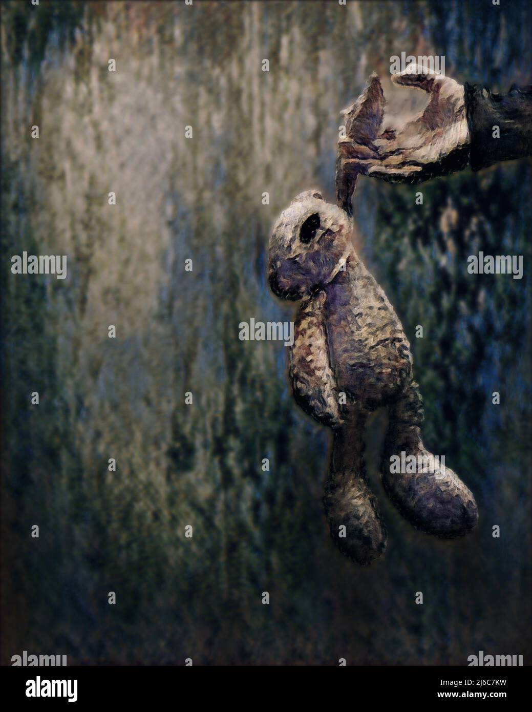 Malerischer Effekt, der zu einem Foto eines Teddybären verarbeitet wurde, der lose von einer Hand gehalten wird Stockfoto