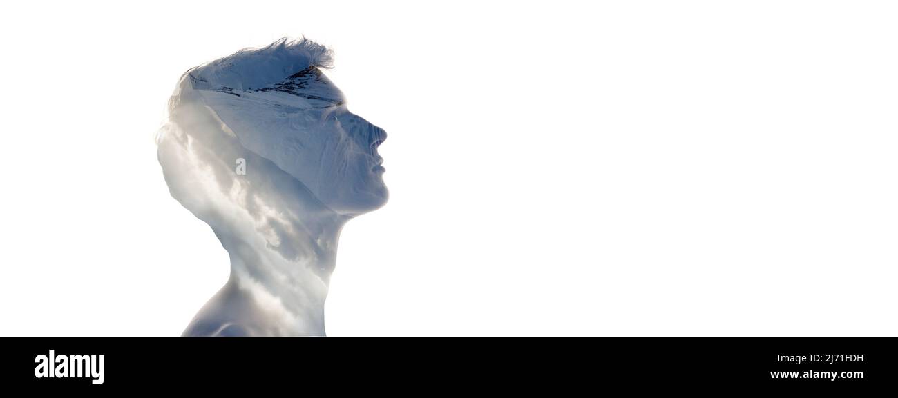 Konzeptuelles Image. Profil Silhouette von jungen transparenten Mann und Naturlandschaft von verschneiten Bergen isoliert auf weißem Hintergrund. Stockfoto