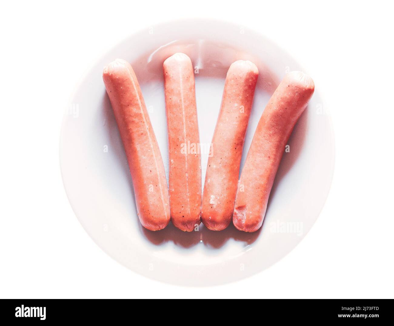 Gegrillte Hotdog-Würstchen auf weißem Teller Stockfoto