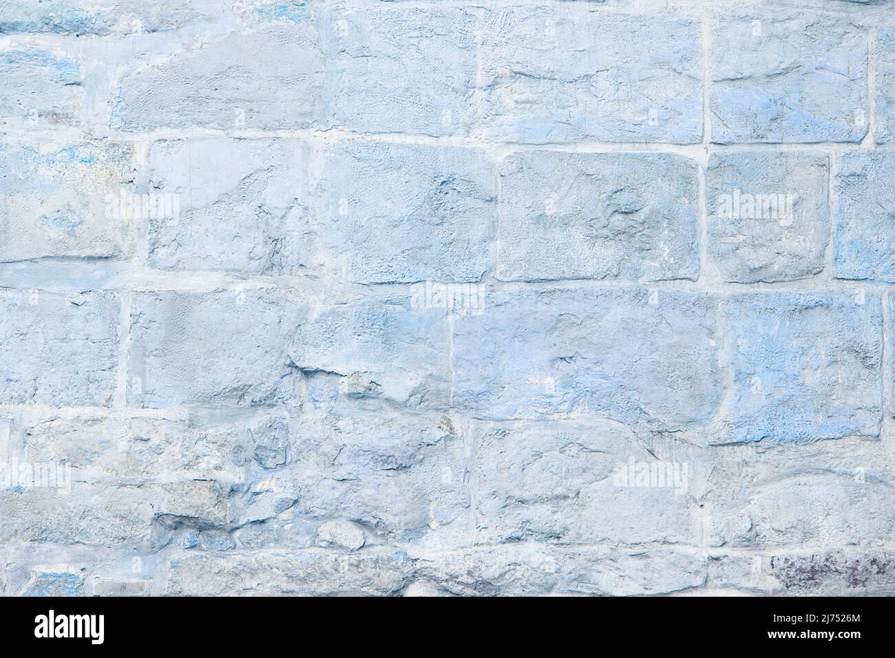 Wand mit weißen Ziegeln. Alte Backsteinmauer Hintergrund. Grunge Backstein Hintergrundstruktur. Blaue Farbtöne Stockfoto