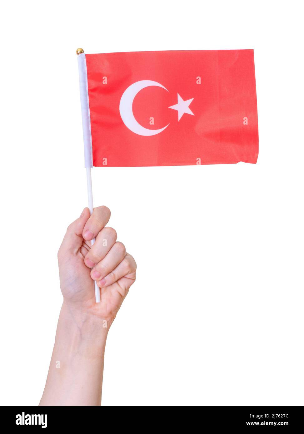 Eine Hand hält die Flagge der Türkei auf einem weißen, isolierten Hintergrund. Konzept des Landes. Stockfoto