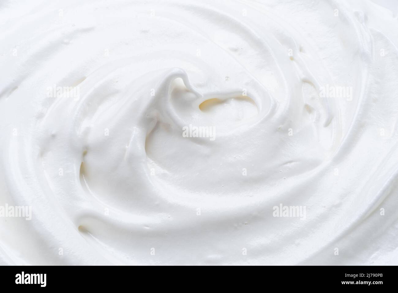 Cremig pic und Wellen in Joghurt oder Creme Oberfläche. Draufsicht. Stockfoto