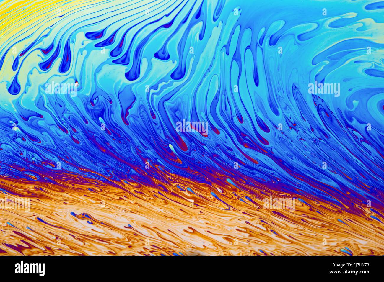 Psychedelischer mehrfarbiger Hintergrund abstrakt. Regenbogen Farben. Muster Hintergrund. Foto-Makro-Aufnahme von Seifenblasen Stockfoto