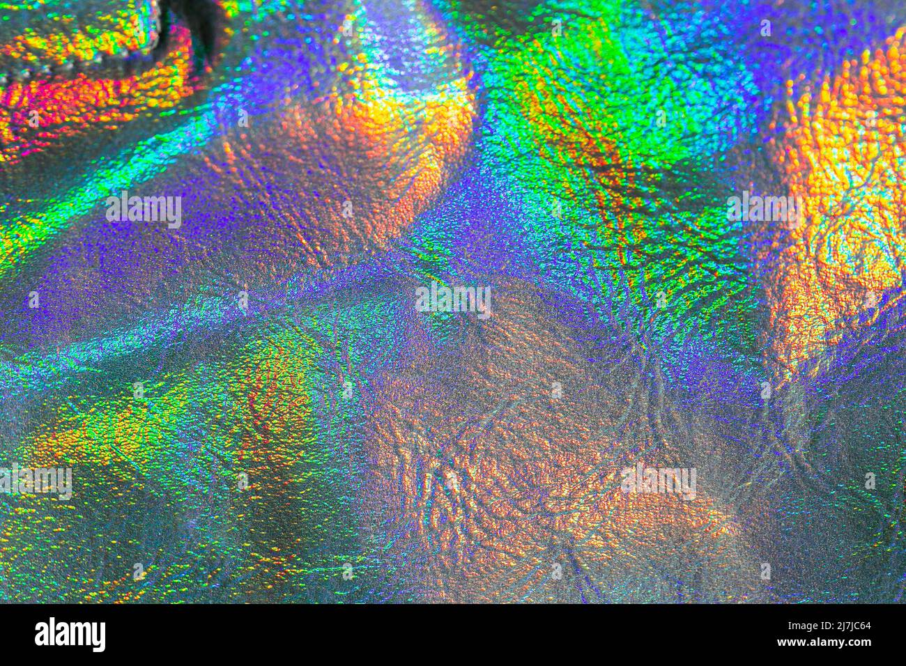 Tapete in silber, lila und grün Farben.Holografischer Hintergrund. Textur mit schillernden Wellen und Falten. Trendige holografischen Hintergrund. Stockfoto