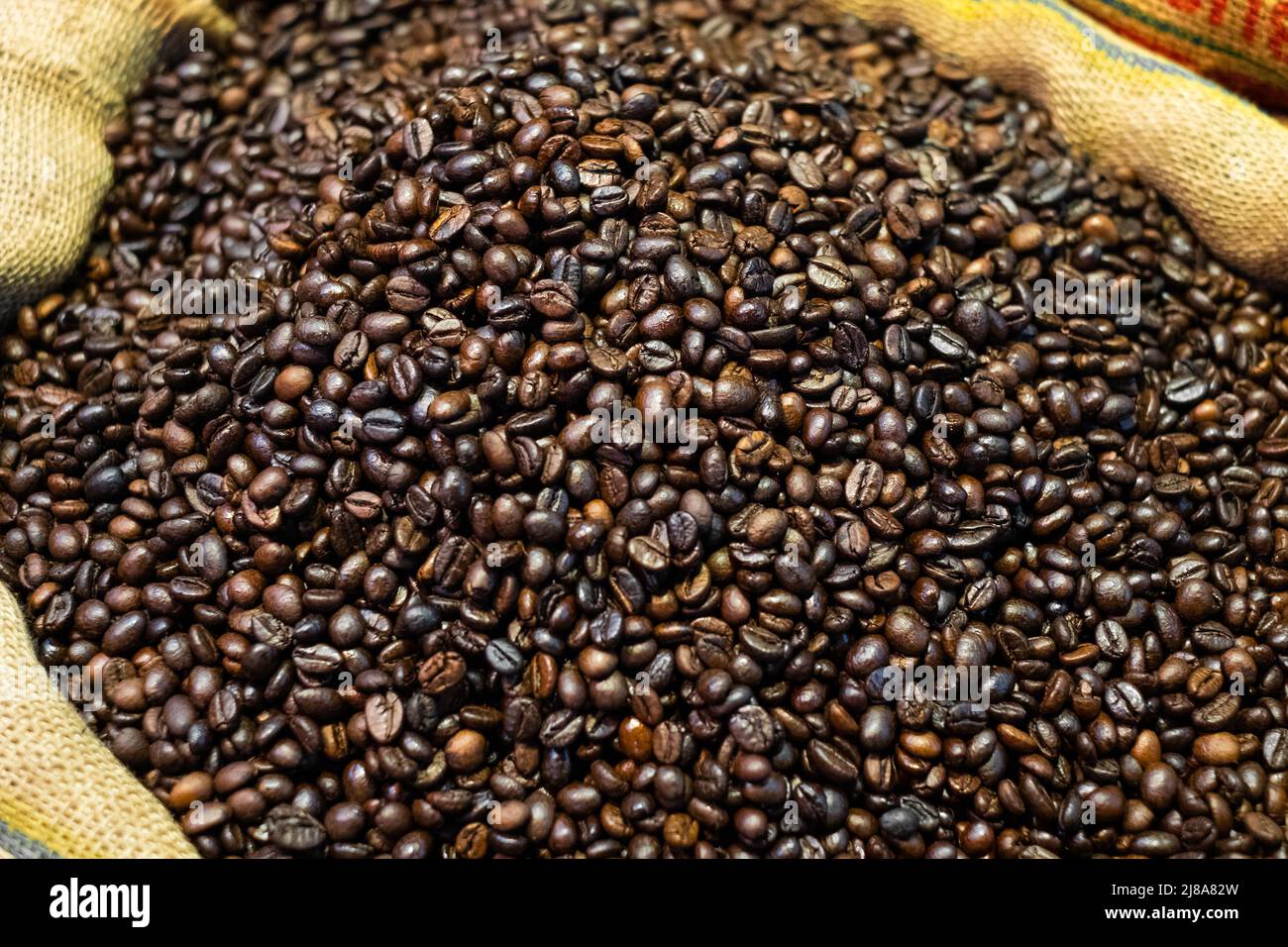 Beutel mit Kaffeebohnen Nahaufnahme, Kaffee Hintergrund Stockfoto