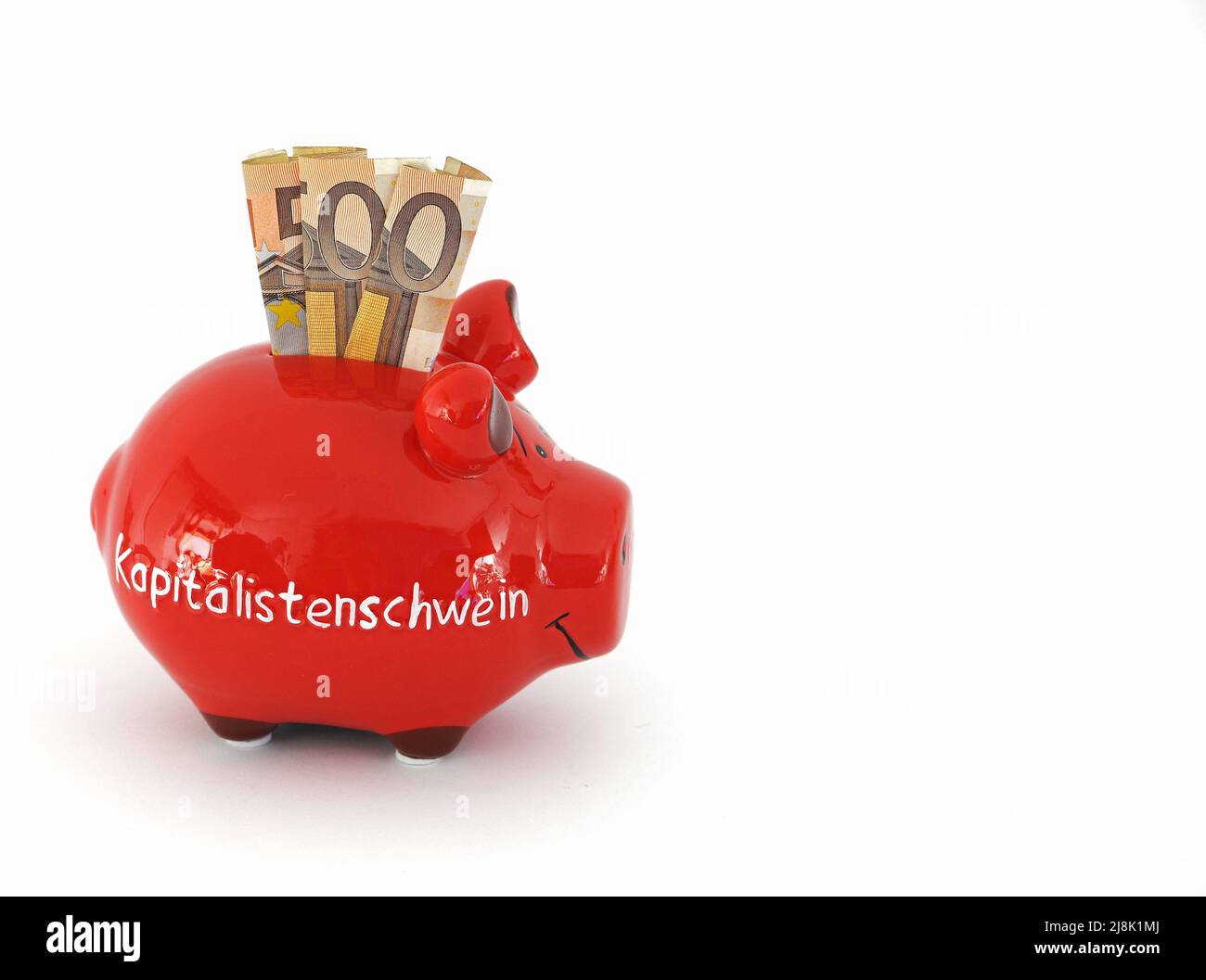 Sparschwein-Schriftzug Kapitalistenschwein, kapitalistisches Schwein mit 50-Euro-Münzen Stockfoto
