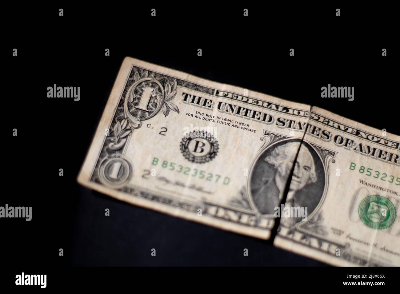 Die Front eines abgenutzten Dollars Stockfoto