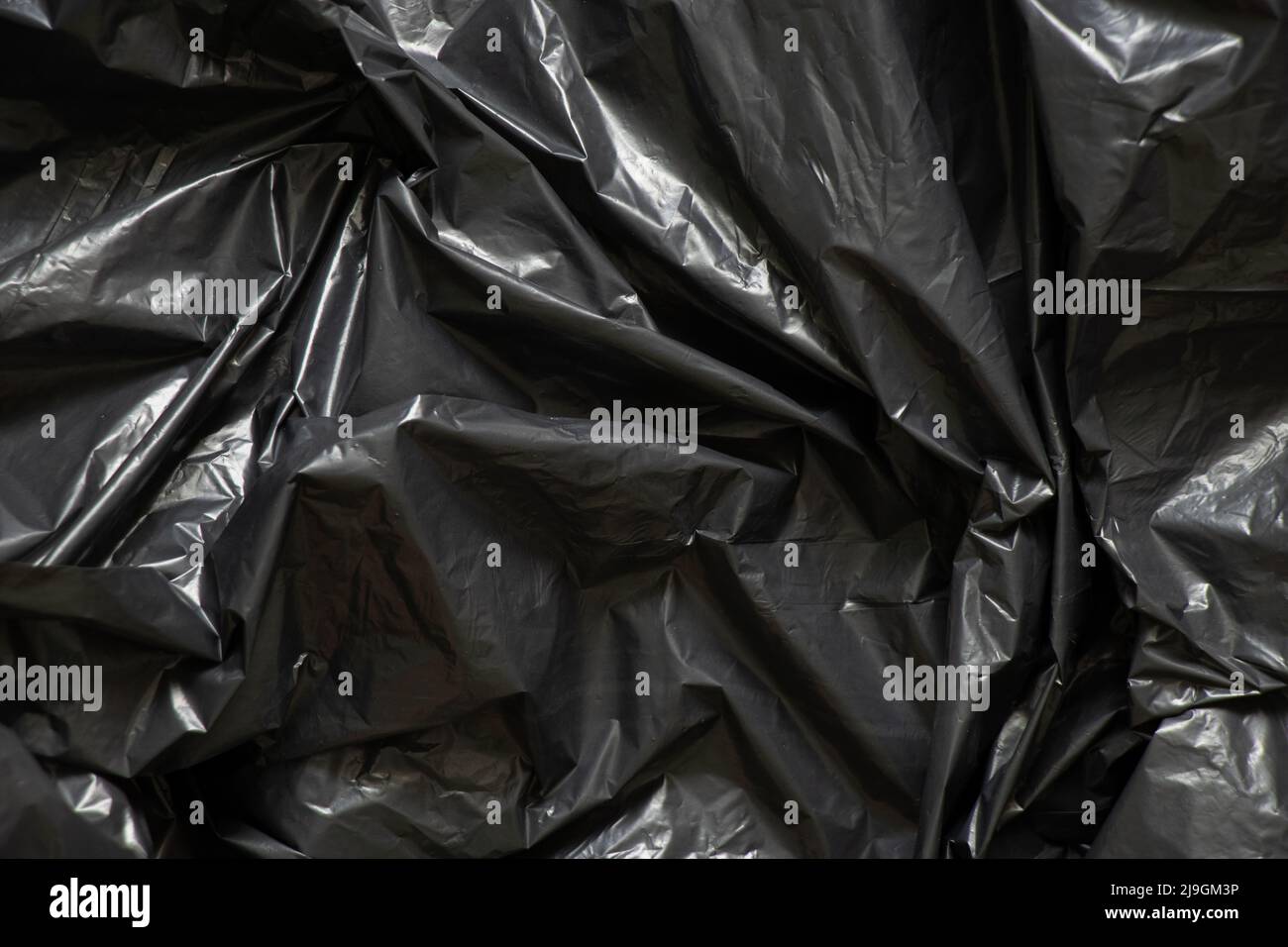 Schwarz zerknittert Film als Hintergrund, schwarz Paket für Hintergründe Stockfoto