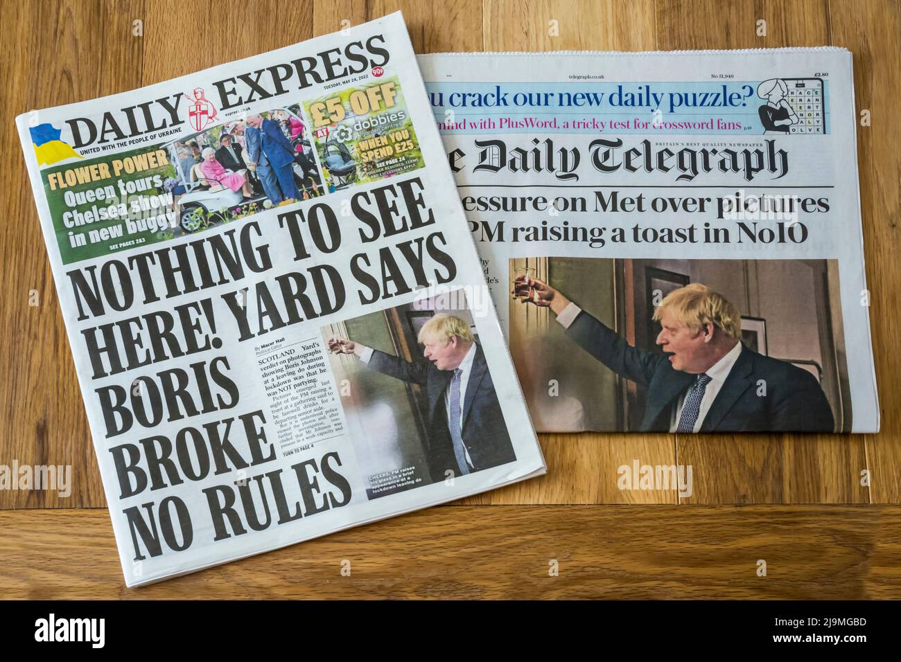 24 Mai 2022. Die Titelseiten von Daily Express & Daily Telegraph hinterfragen das Urteil der Metropolitan Police, während neue Bilder von den Lockdown-Partys von Boris Johnson & Downing Street entstehen. Stockfoto