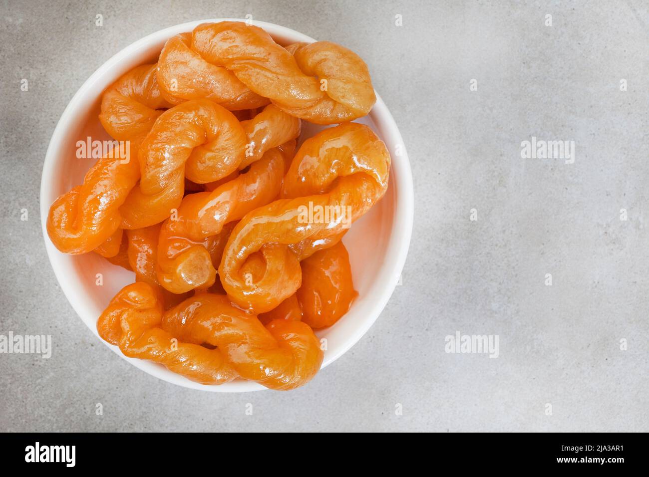 Köstliche, goldene, mit Sirup getränkten traditionellen südafrikanischen Koekschwestern Stockfoto