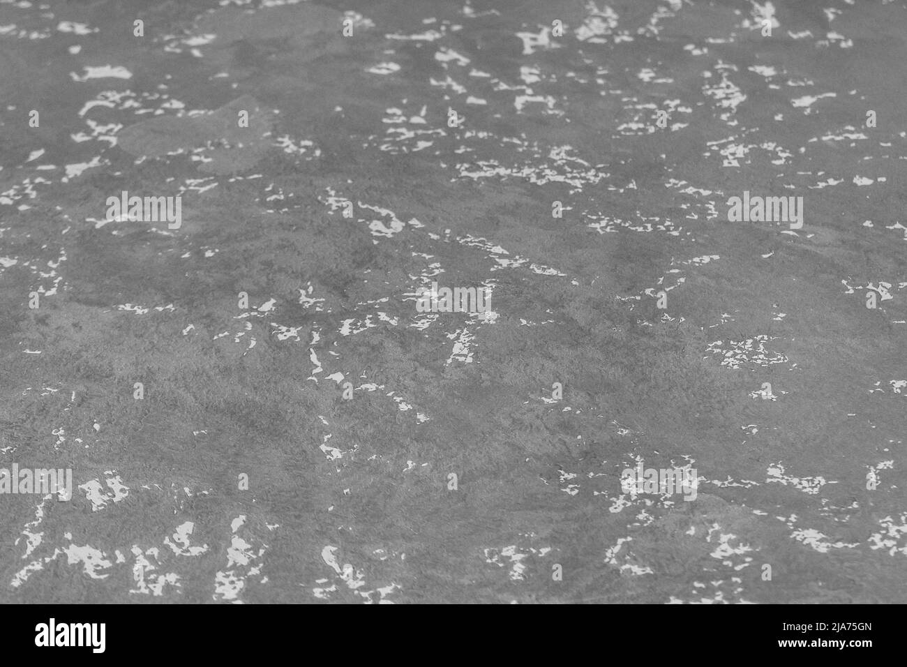 Graue Gipswand mit abstraktem Muster Stuckstruktur Hintergrundfläche. Stockfoto