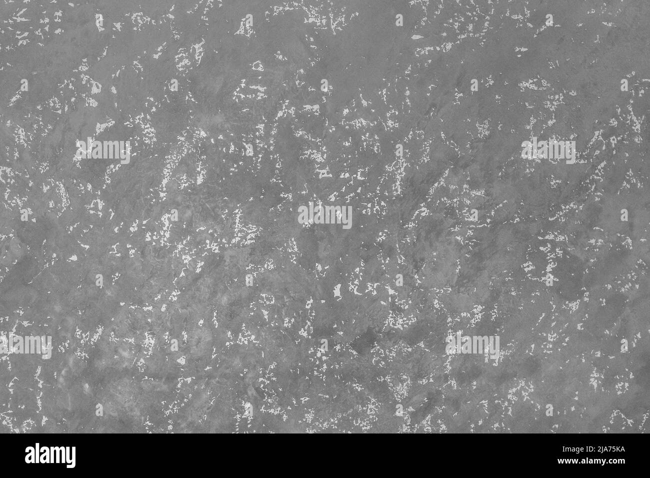 Graue Gipswand mit abstraktem Muster Stuckstruktur Hintergrundfläche. Stockfoto