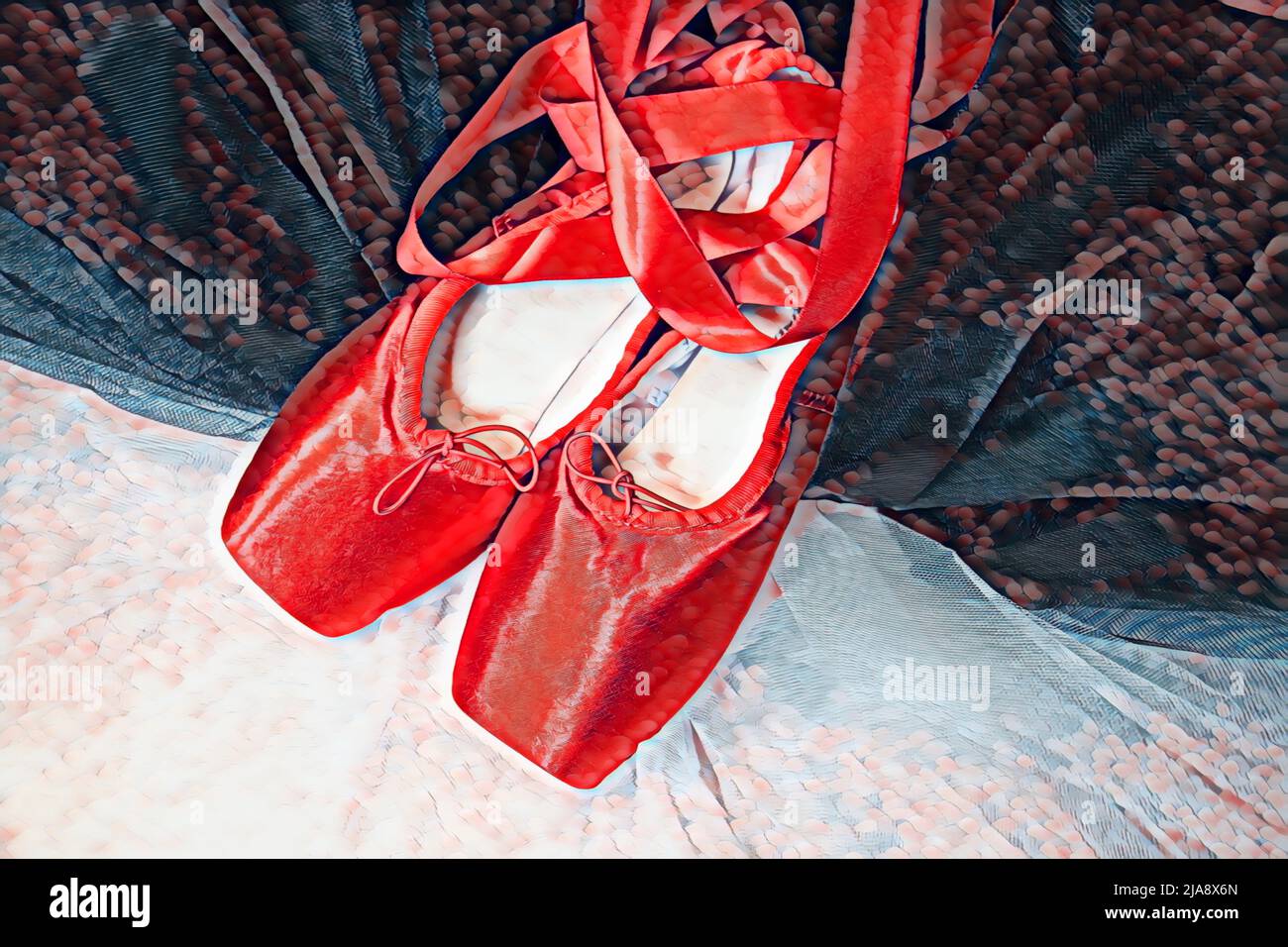 Rote Ballet spitzenschuhe, die auf einem weißen und schwarzen Tutu ruhen. Stockfoto