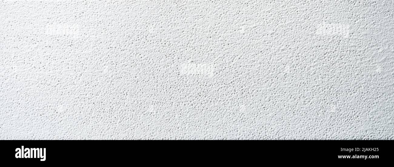 Abstrakter weißer Hintergrund mit Schwammplatte Oberfläche. Weiße strukturierte Blattfläche Stockfoto