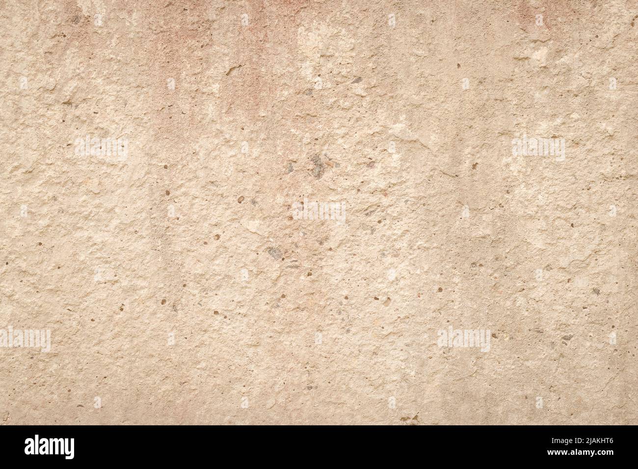 Beigefarbene Zementwand, abstrakt heller Hintergrund. Beton-Grunge-Struktur, Stuck. Gipsoberfläche. Leerzeichen. Designhintergrund. Natürliche grungy Tapete Stockfoto