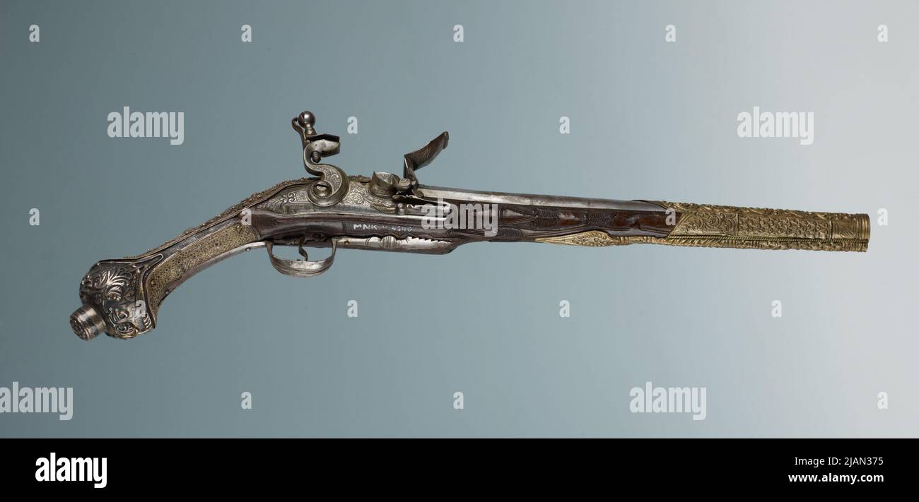 Pistole mit einer Felsenburg Stockfoto