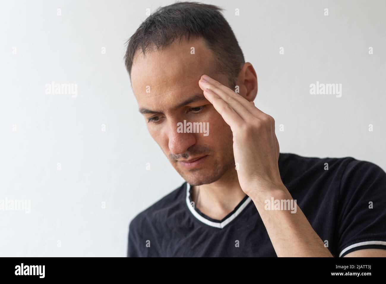 Mann mit Kopfschmerzen, Kopfschmerz, Schmerzen Stockfoto