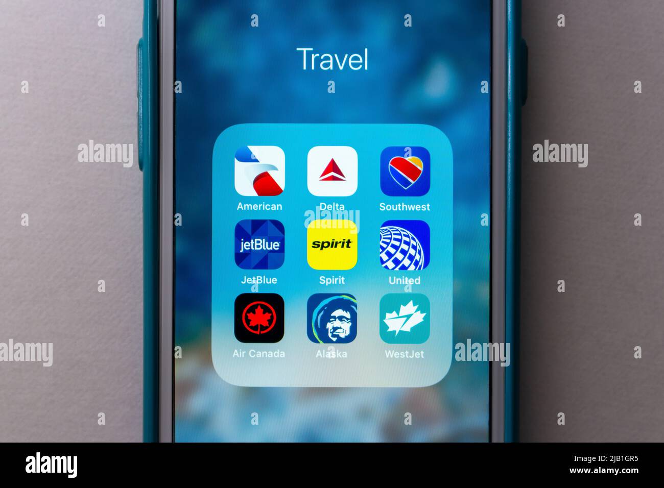 Symbole DER US-Fluggesellschaften auf dem iPhone (American Airlines, Delta, Southwest, United Airlines, Air Canada, Alaska Airlines, JetBlue Airways, Spirit und WestJet). Stockfoto