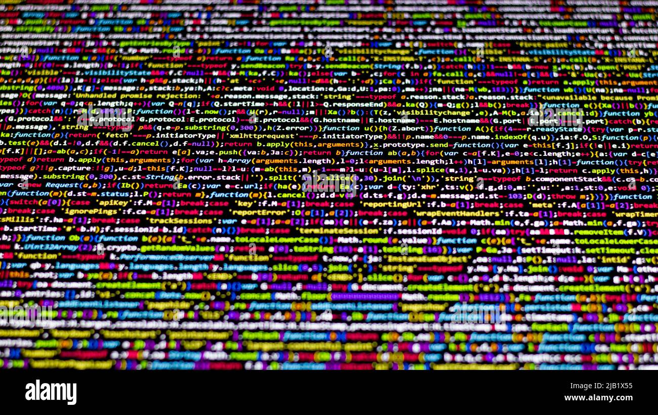 Farbenfroher Code-Hintergrund. Komprimierter javascript-Code auf dem Computerbildschirm. Bildschirm für die Codierung von Softwareentwicklern Stockfoto