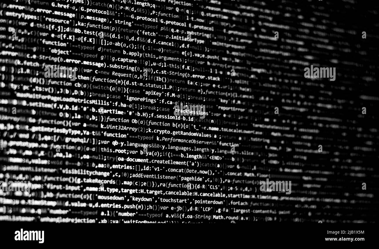 Schwarz-weißer Code-Hintergrund. javascript-Code auf dem Computerbildschirm Stockfoto
