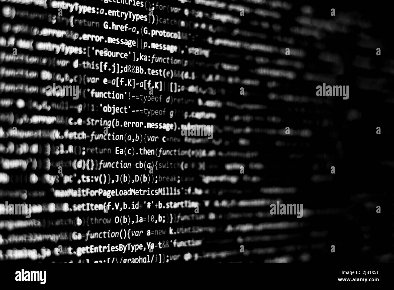 Schwarz-weißer Code-Hintergrund. javascript-Code auf dem Computerbildschirm Stockfoto