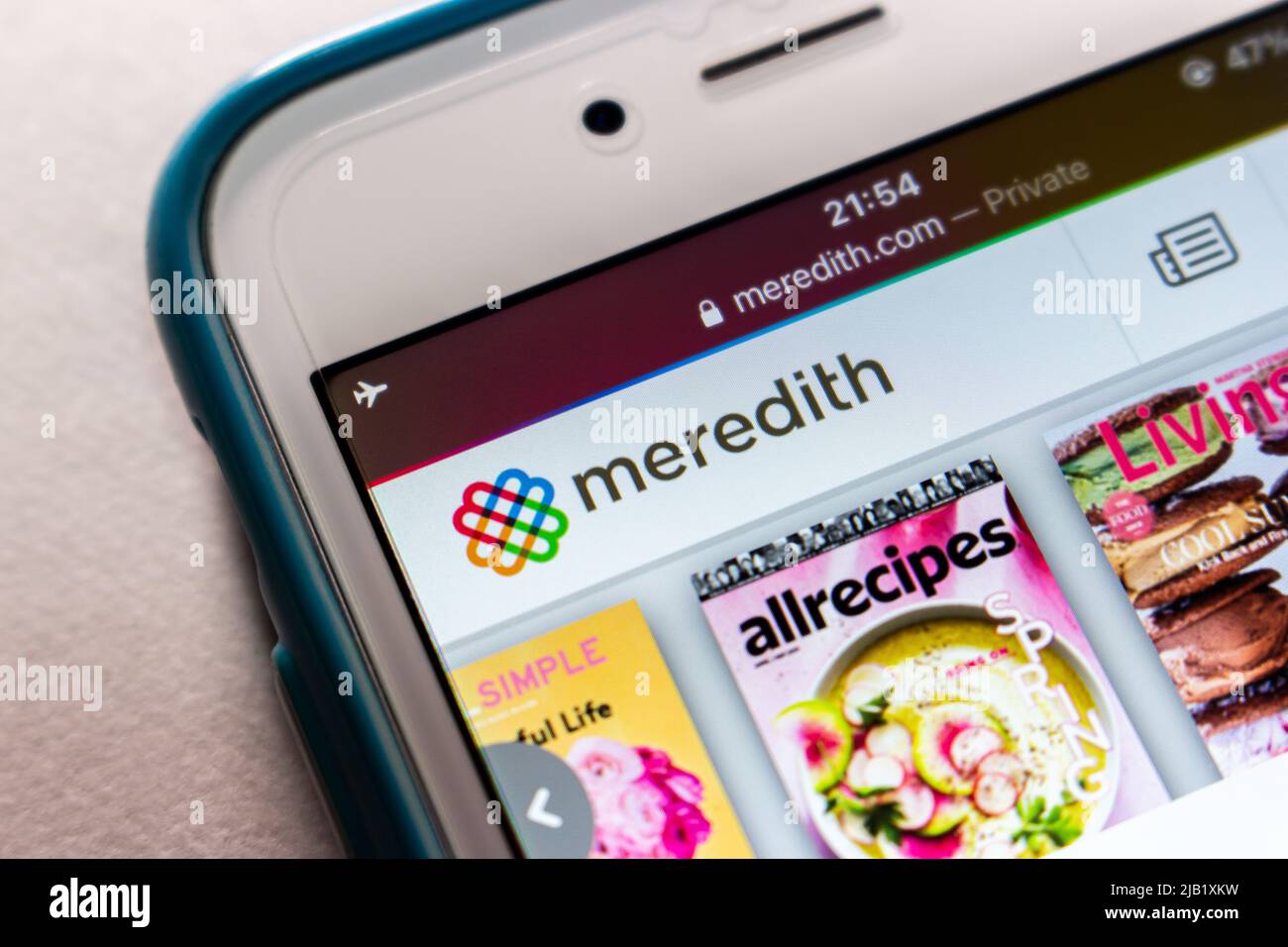 Logo der Meredith Corporation, eines US-Medienkonzerns, der Zeitschriften, Fernsehsender, Websites und Radiosender besitzt, auf seiner iPhone-Website Stockfoto