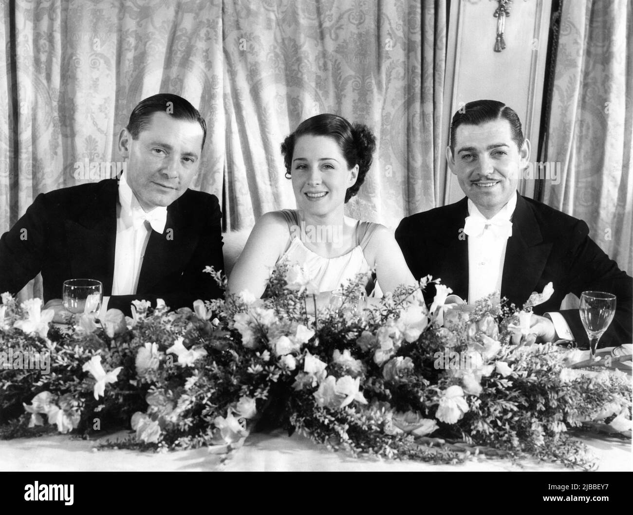 Gäste HERBERT MARSHALL NORMA SHEARER und CLARK GABLE bei den Academy Awards 6. im Fiesta Room des Ambassador Hotels am Freitag, den 16. 1934. März Stockfoto