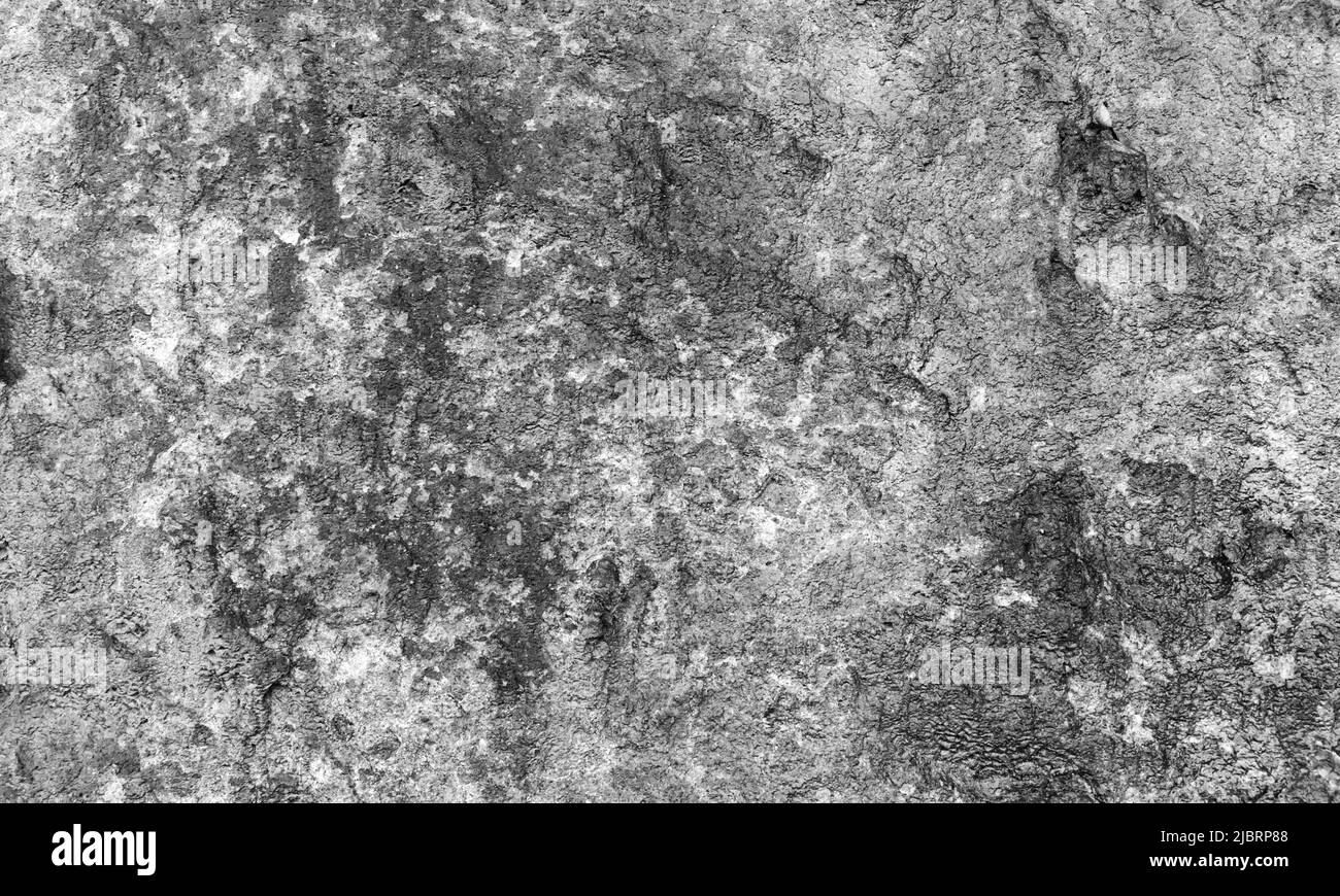 Graue Felswand Textur, natürlicher grober Stein, Hintergrundfoto Stockfoto