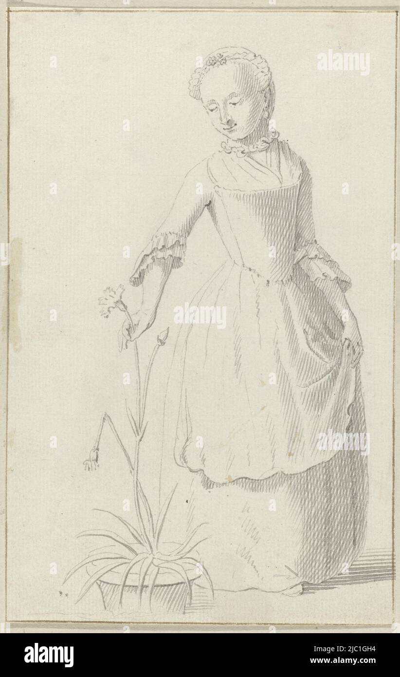 Stehende Frau pflückt eine Blume aus einer Pflanze in einem Blumentopf, Zeichner: Anonym, Niederlande, c. 1700 - c. 1799, Papier, Stift, H 196 mm × B 125 mm Stockfoto