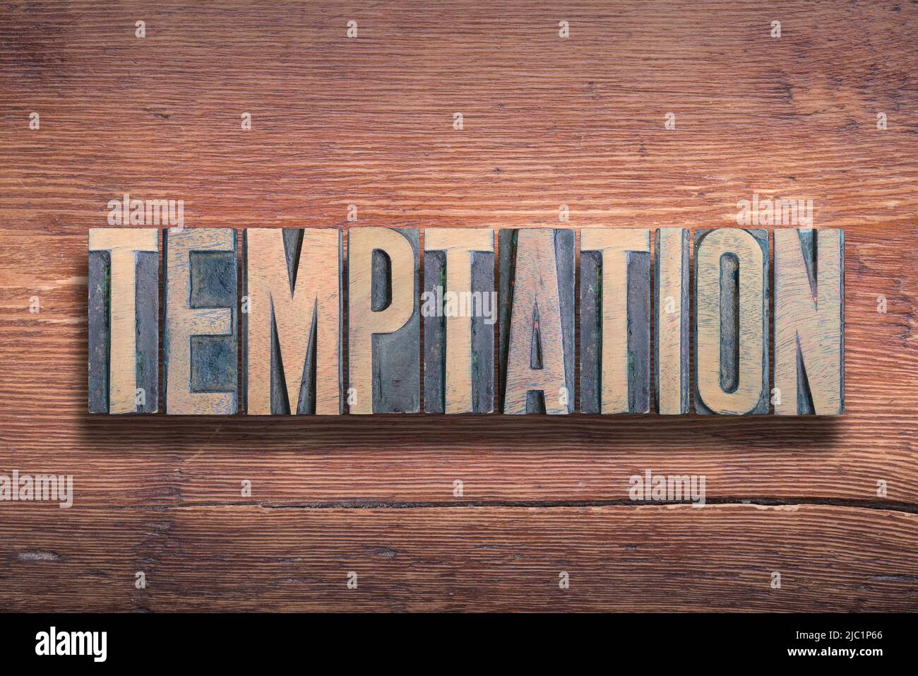 Versuchung Wort kombiniert auf vintage lackierte Holzoberfläche Stockfoto