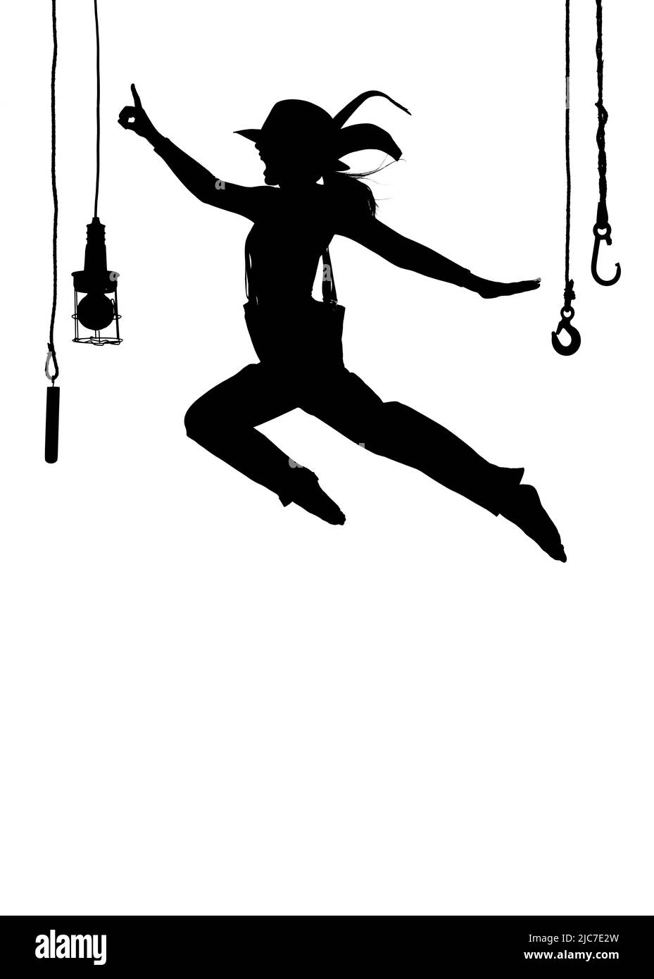 Eine Tänzerin wird auf der Bühne getanzt. In Herrenbekleidung gekleidet und mit einem Männerhut bekleidet, sieht man sie als Silhouette in der Luft springen. Stockfoto