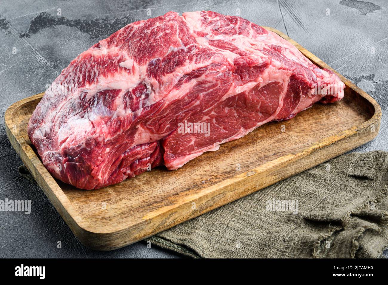 Rohes frisches Fleisch Ribeye-Steak Encote von Black Angus Prime Fleisch, auf grauem Steinhintergrund Stockfoto