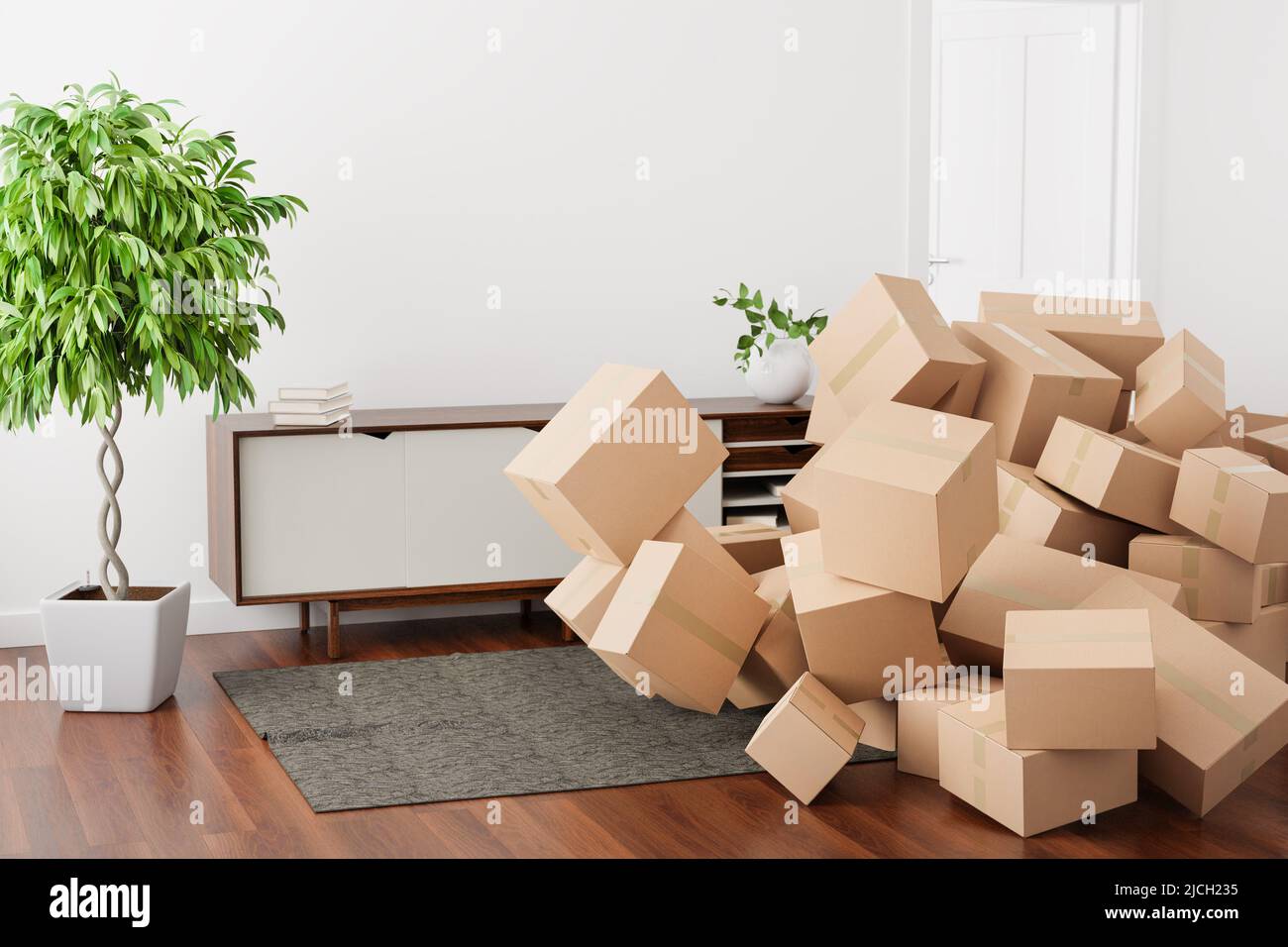 Unterschiedlich große Kartons, die in ein Wohnzimmer fallen. Konzeptbild für Konsumdenken, Online-Shopping Stockfoto