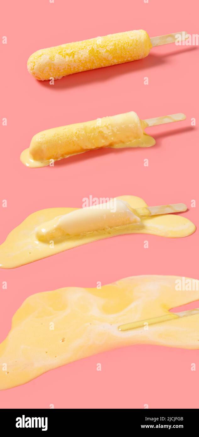 Gelber Milchshake-Geschmack Aufschmelzprozess der Eiszapfen auf einem rosa Hintergrund Stockfoto