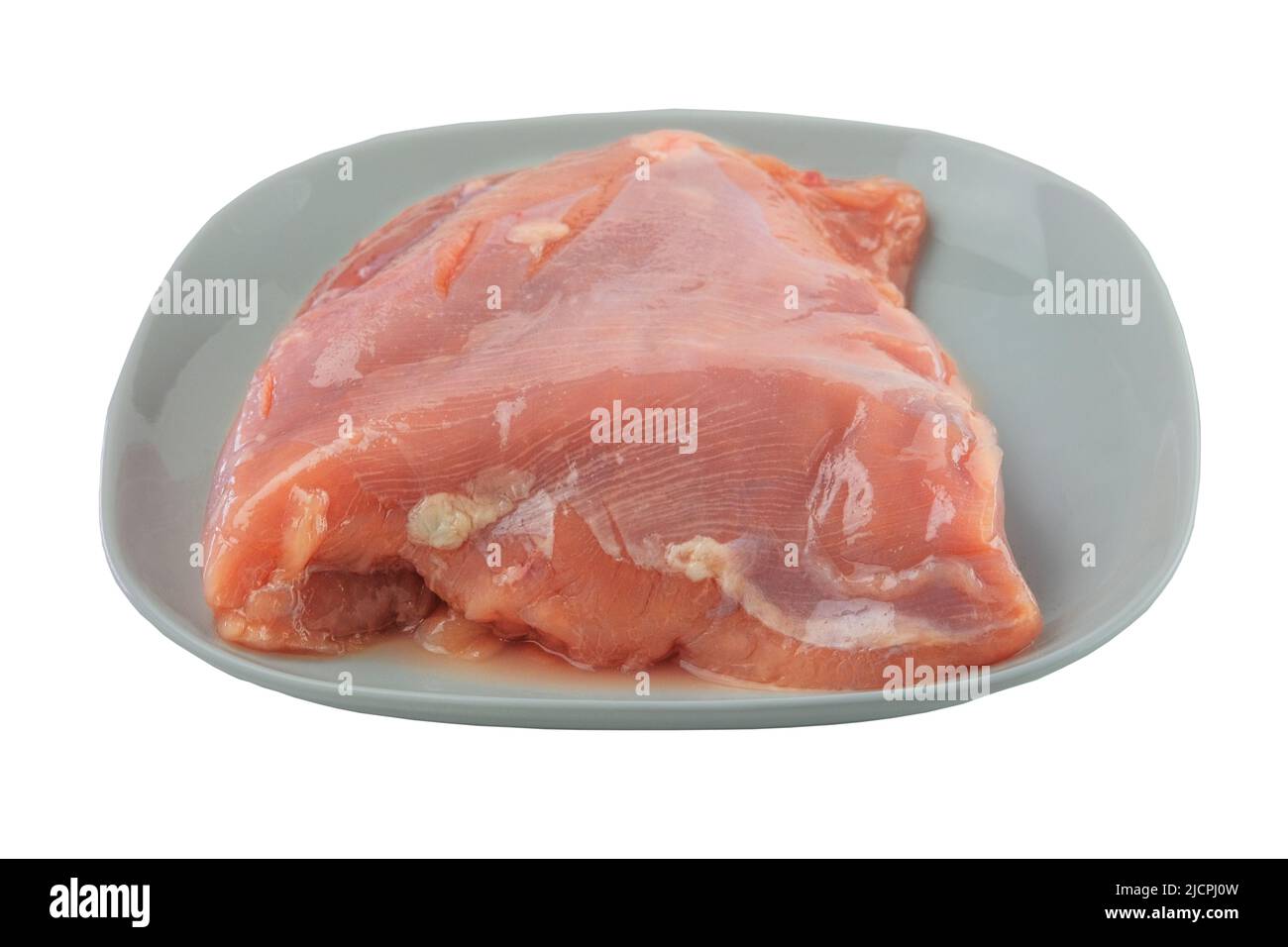 Putenfilet in Platte isoliert auf weißem Hintergrund. Rohes Fleisch zum Kochen. Stockfoto