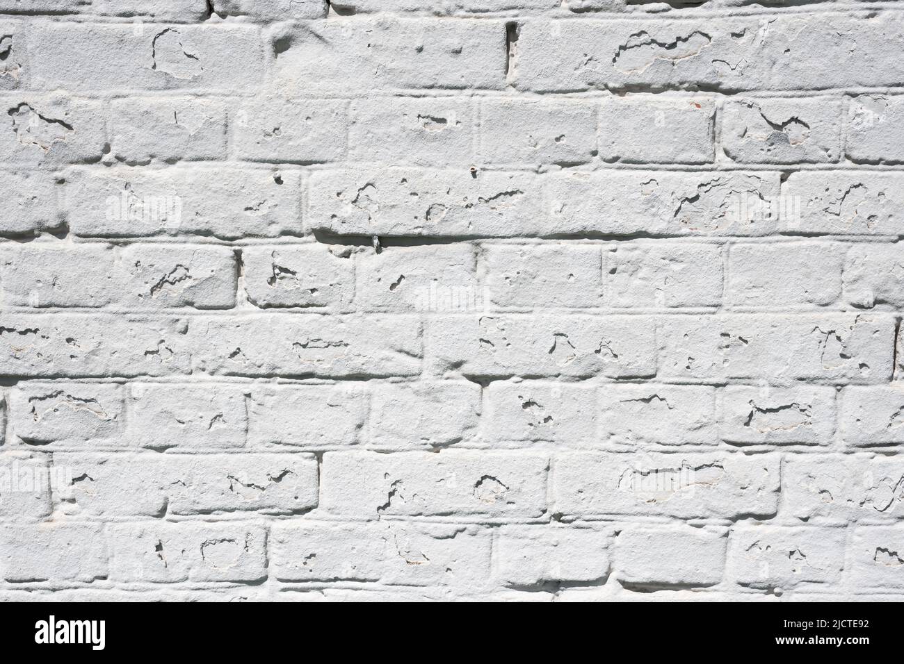Grunge weißen Backstein Wand Hintergrund mit alternder Textur Nahaufnahme Stockfoto