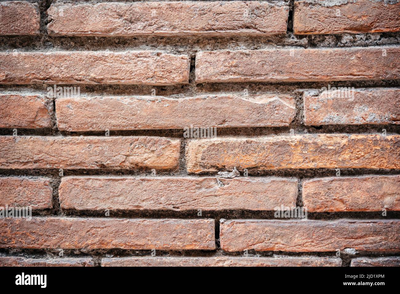 Ein alter roter Backsteinwand Hintergrund Stockfoto