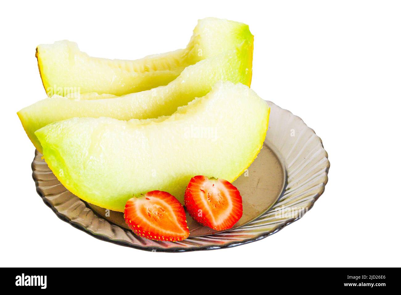 Reife Melone und reife Erdbeeren auf einem Teller Stockfoto