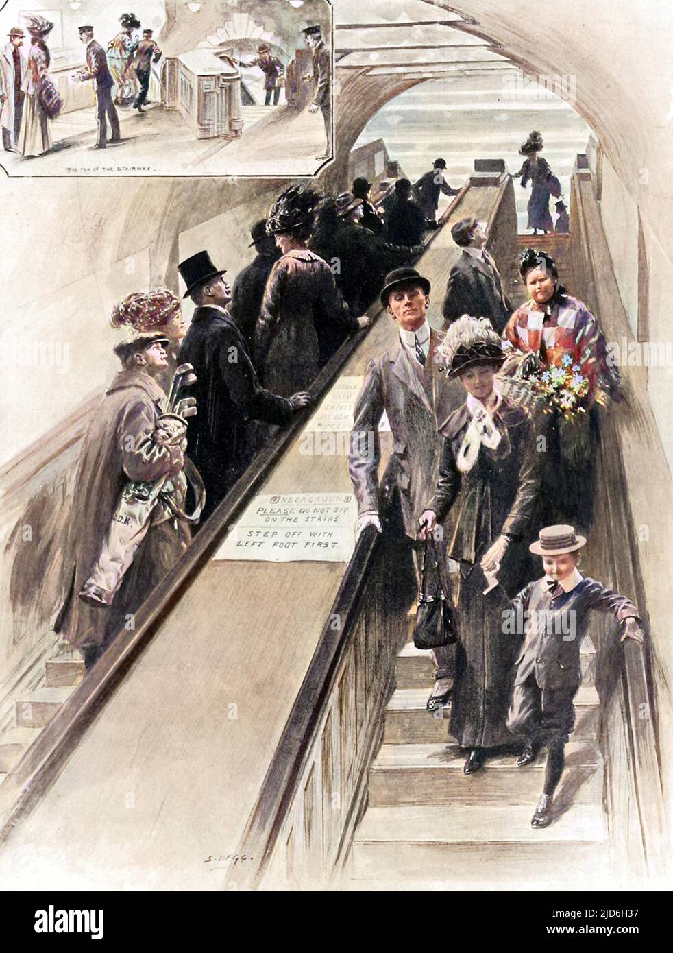 Die ersten Rolltreppen, die jemals in der U-Bahn zwischen dem District und den Plattformen der Piccadilly-Linie am Bahnhof Earls Court installiert wurden. Zu dieser Zeit boten sie den Passagieren, die sie benutzten, eine großartige Unterhaltung. Kolorierte Version von: 10216058 Datum: 1911 Stockfoto