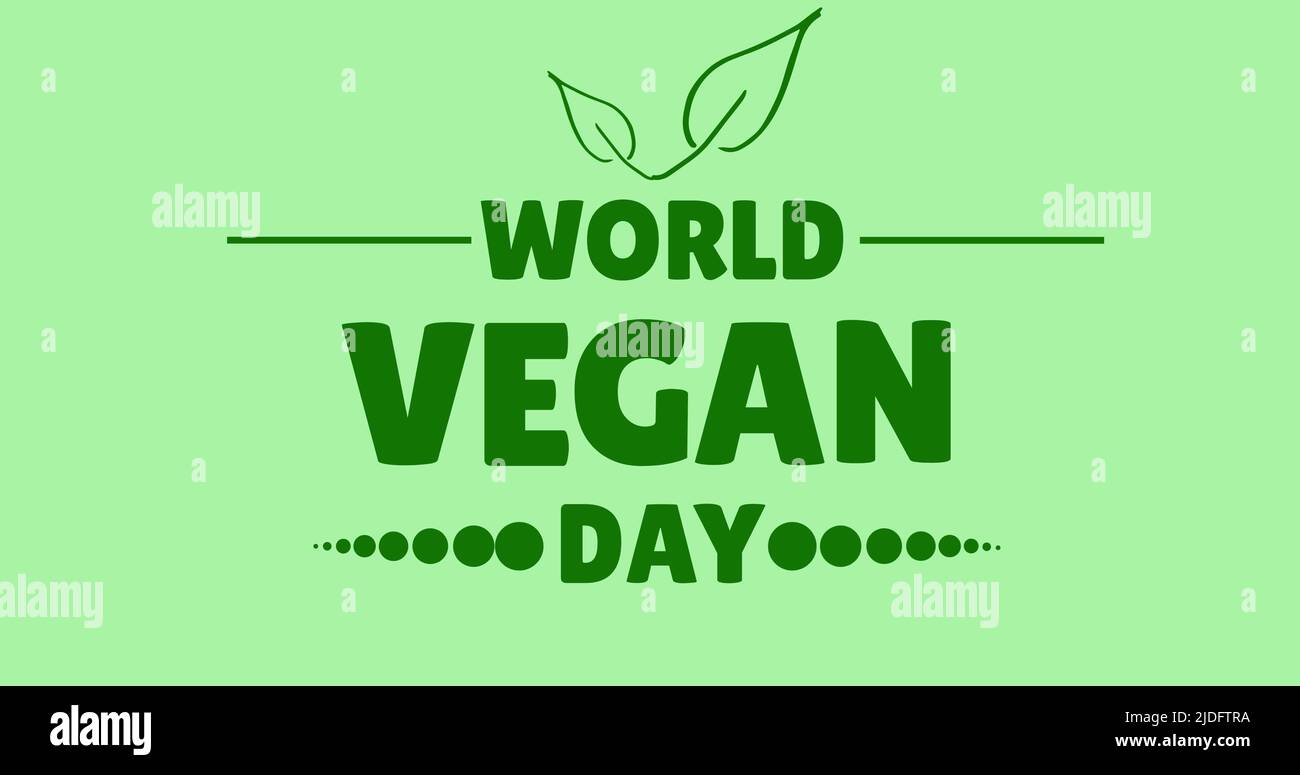 Bild des veganen Tages-Welttextes in grün, auf hellgrünem Hintergrund Stockfoto