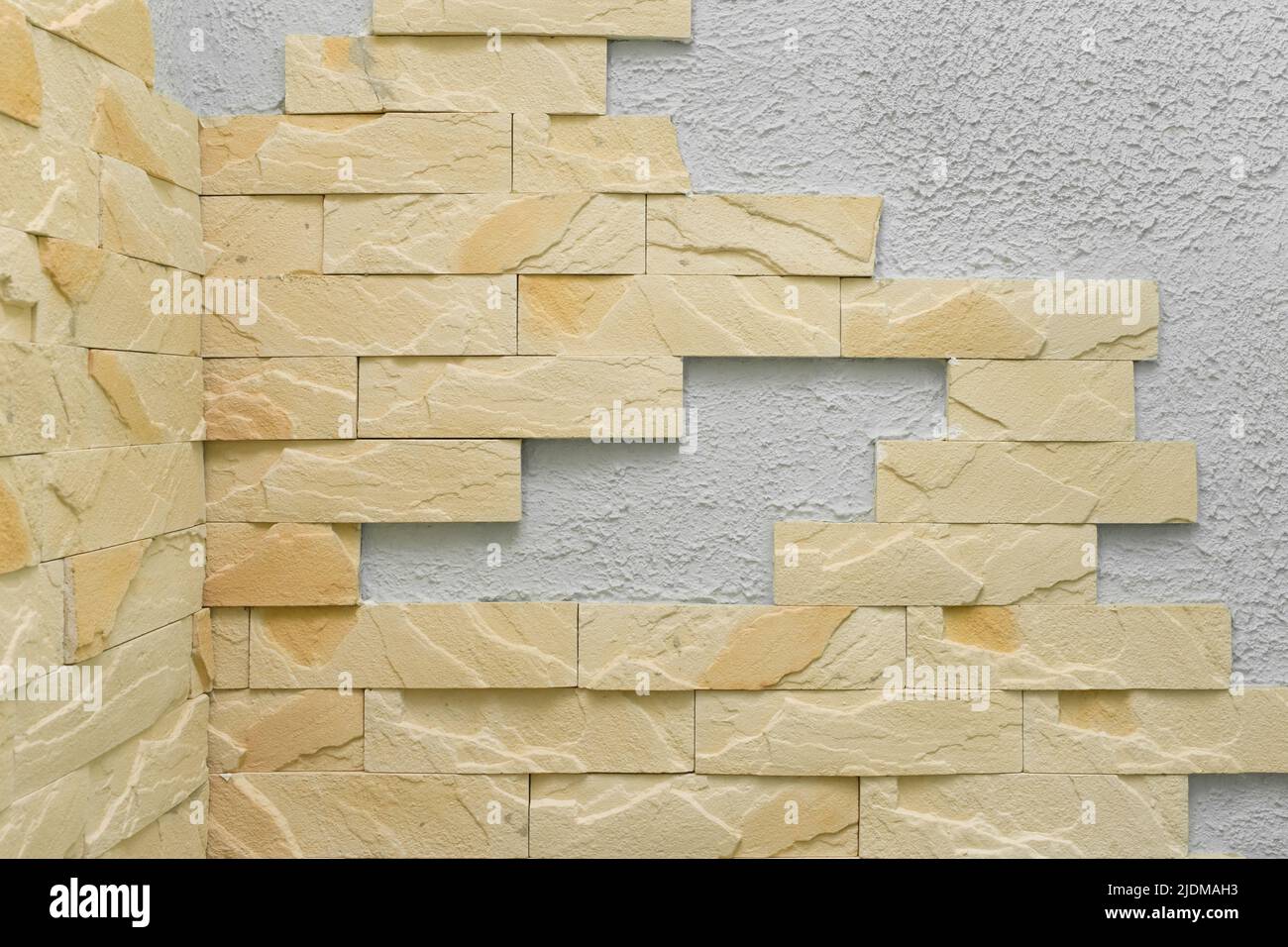 Licht Backstein Element Fragment abstrakt Innenarchitektur Wandmuster Sand Ton Farbe Textur Fassade Hintergrund. Stockfoto