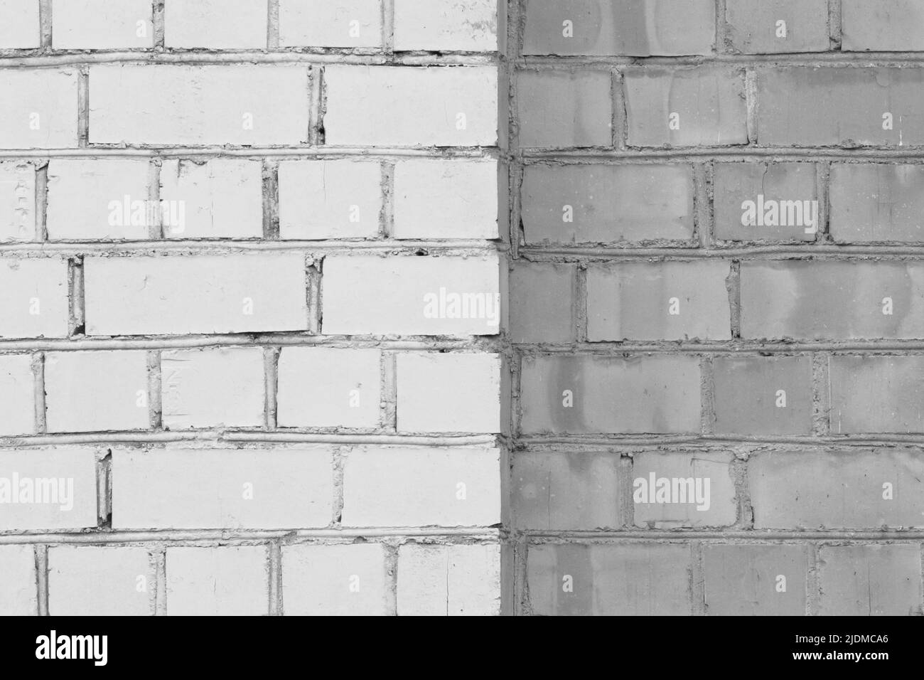 Ziegelwand zwei Farben weiß und grau abstrakt städtischen Hintergrund Design Kunst Textur. Stockfoto